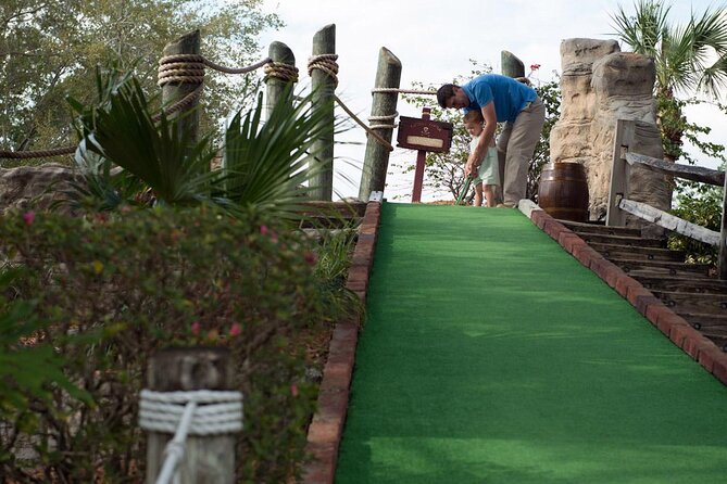 Pirate's Cove Adventure Golf Entry Ticket in Orlando - What you’ll actually see: waterfalls, dungeons, and shipwreck vibes